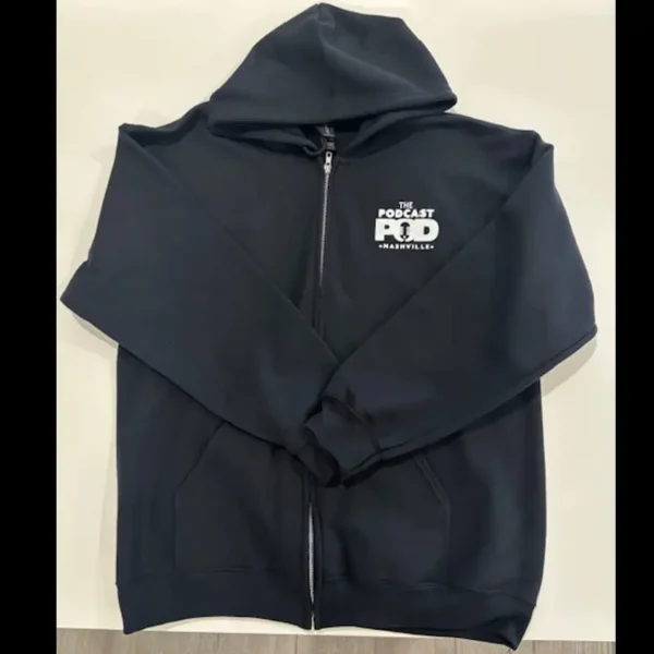 Front of black zip-up Podcast Pod hoodie with small white Nashville logo on left chest